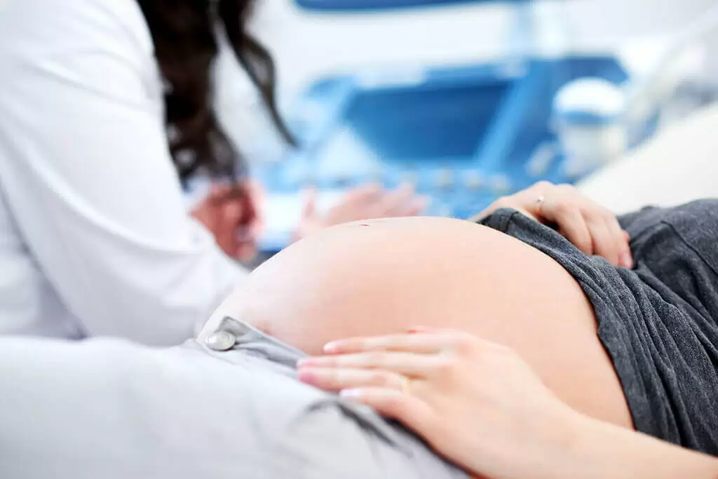 Pregnant woman with visible linea nigra â€